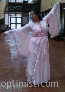Annie Yao, junior marketing major from China, elegantly displays traditional Chinese dancing