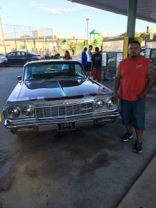 Jason Deleon shows his 1964 Impala.
