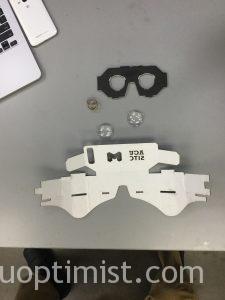 Virtual reality goggles with five parts at a cost of about $3.00 per set of goggles.