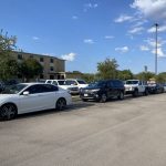 Cars parked in parking lot. Photo by Paige Taylor
