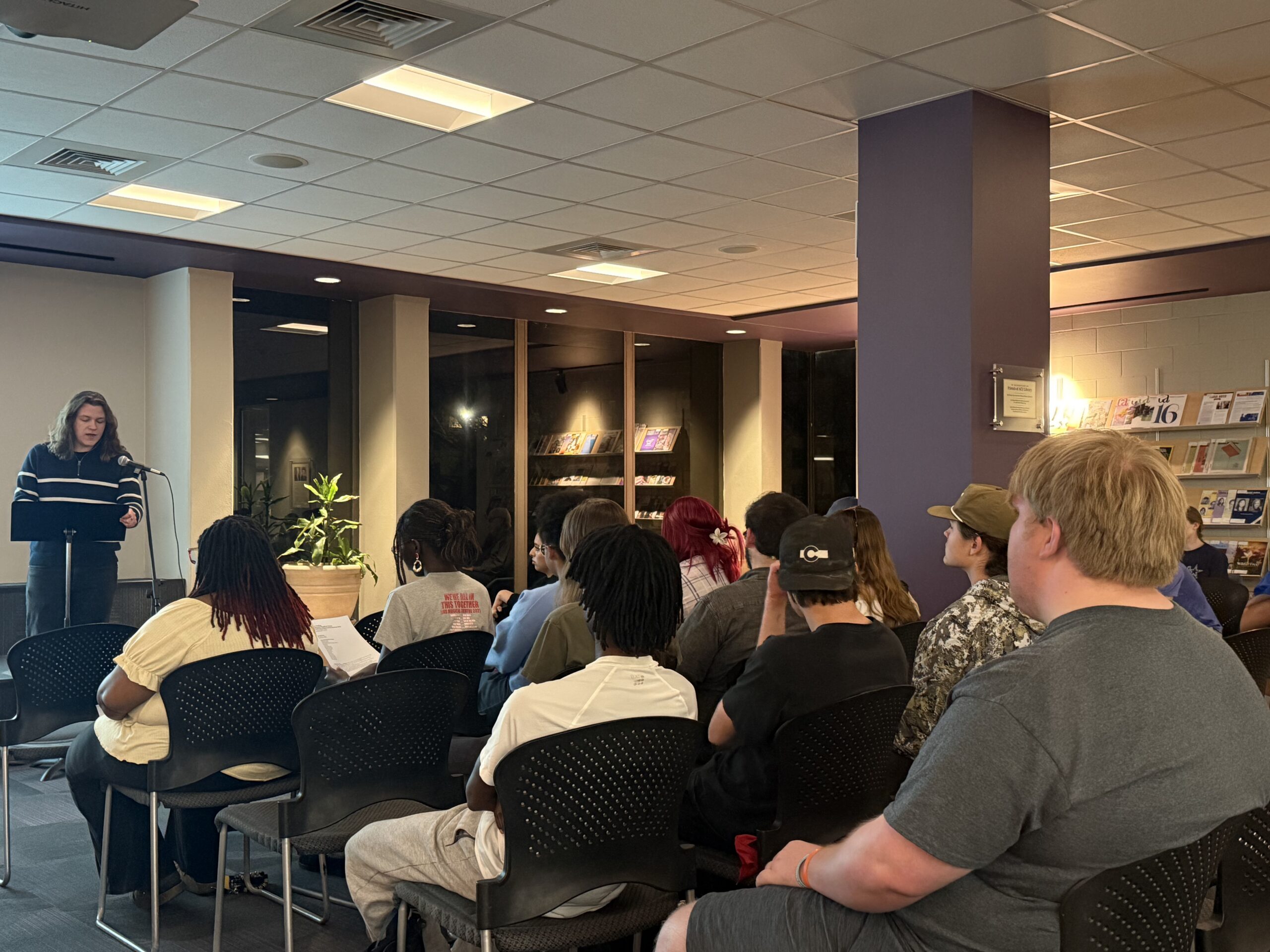 Poetry packs the room: Students respond to art exhibit with poetry reading